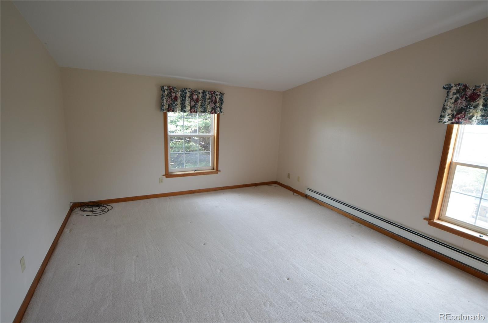 74500 East 136th Avenue Byers, CO 80103 - Photo 8 of 31 an empty room with windows