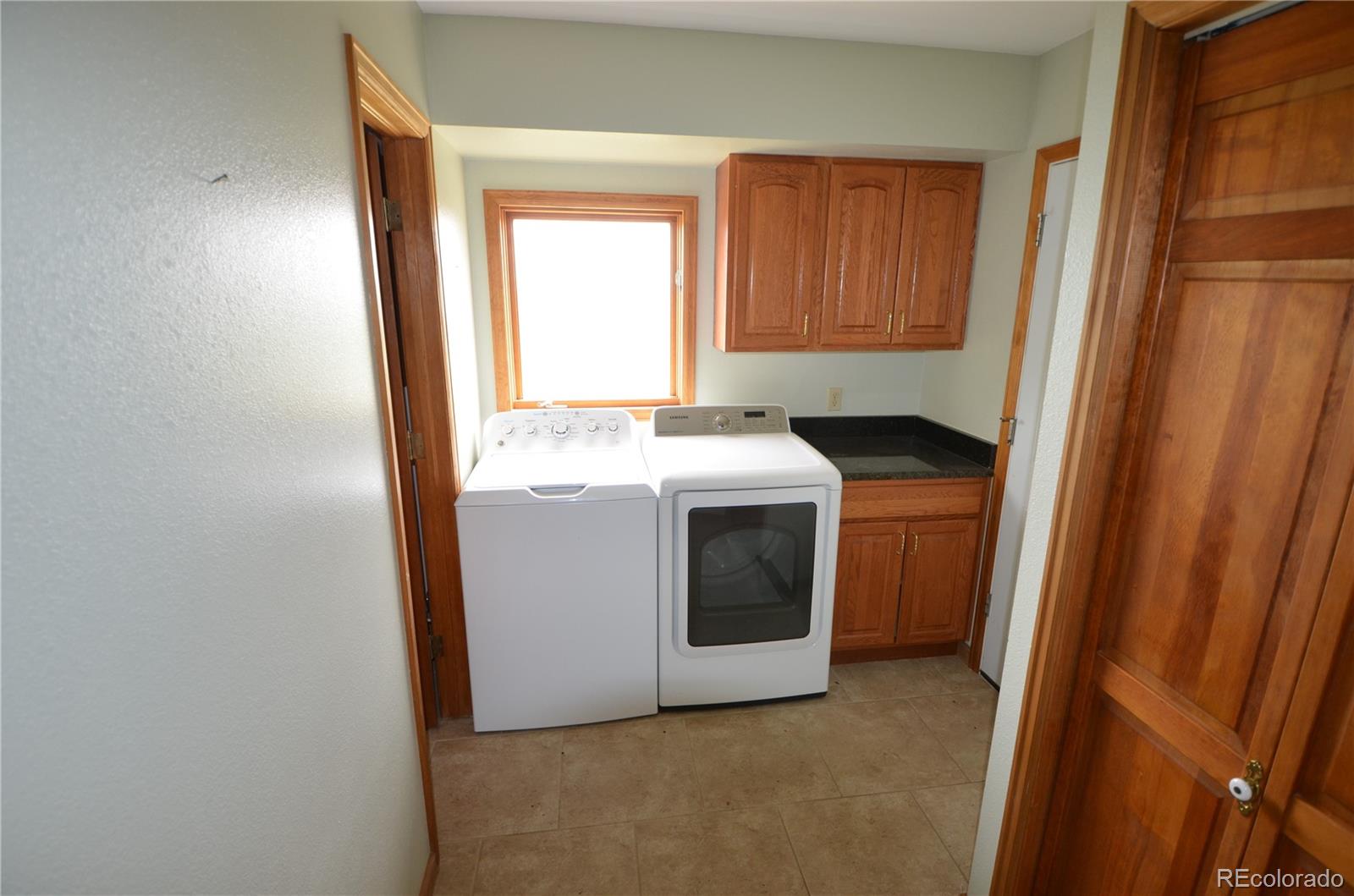 74500 East 136th Avenue Byers, CO 80103 - Photo 10 of 31 a utility room with dryer and washer