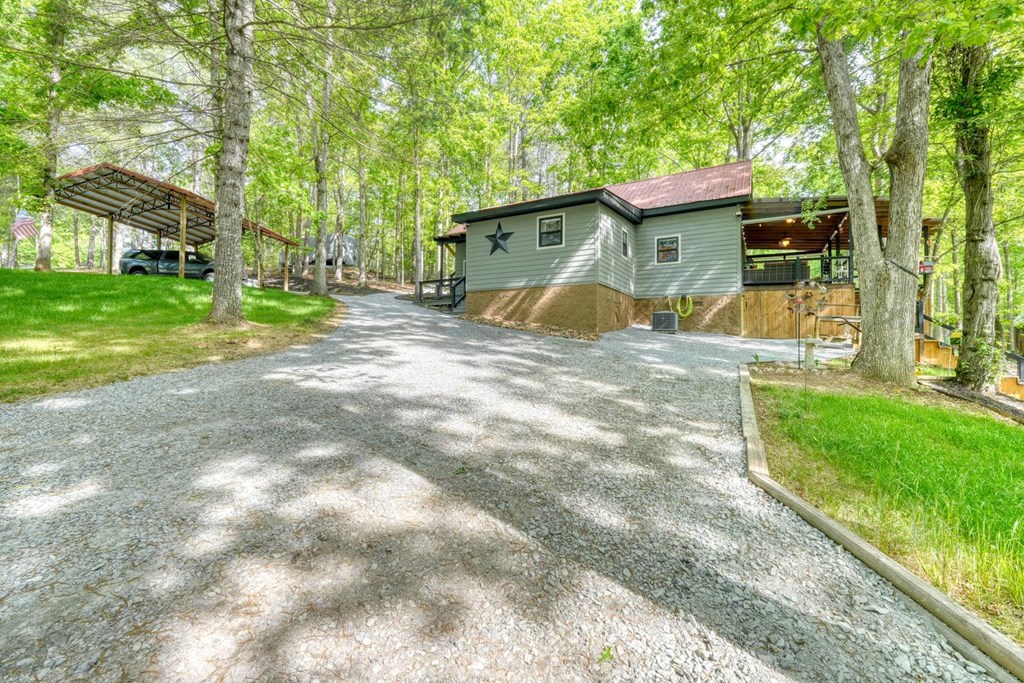 919 New Hope Road Morganton, GA 30560 - Photo 11 of 52 a view of a house with a yard