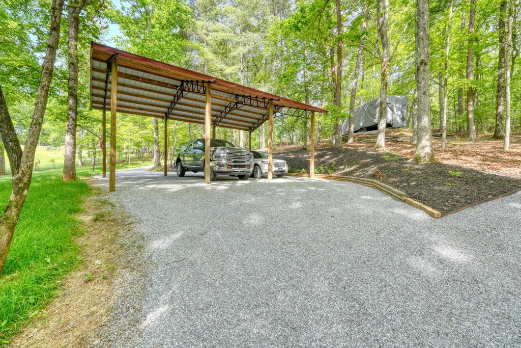 919 New Hope Road Morganton, GA 30560 - Photo 12 of 52 a view of backyard with a table and chairs under an umbrella