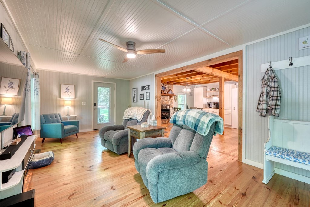 919 New Hope Road Morganton, GA 30560 - Photo 17 of 52 a living room with furniture and a wooden floor