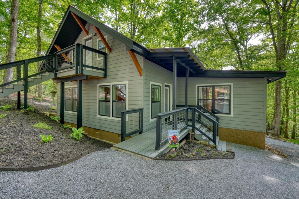 919 New Hope Road Morganton, GA 30560 - Photo 2 of 52 a view of a house with a small yard and wooden fence
