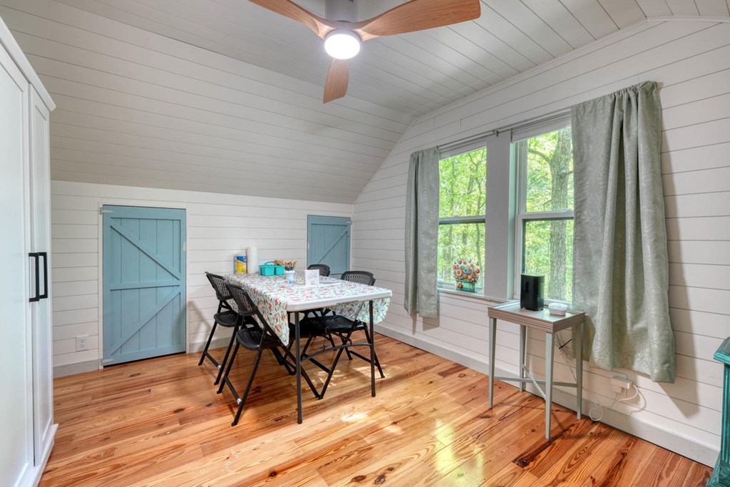 919 New Hope Road Morganton, GA 30560 - Photo 41 of 52 a workspace with furniture window and wooden floor