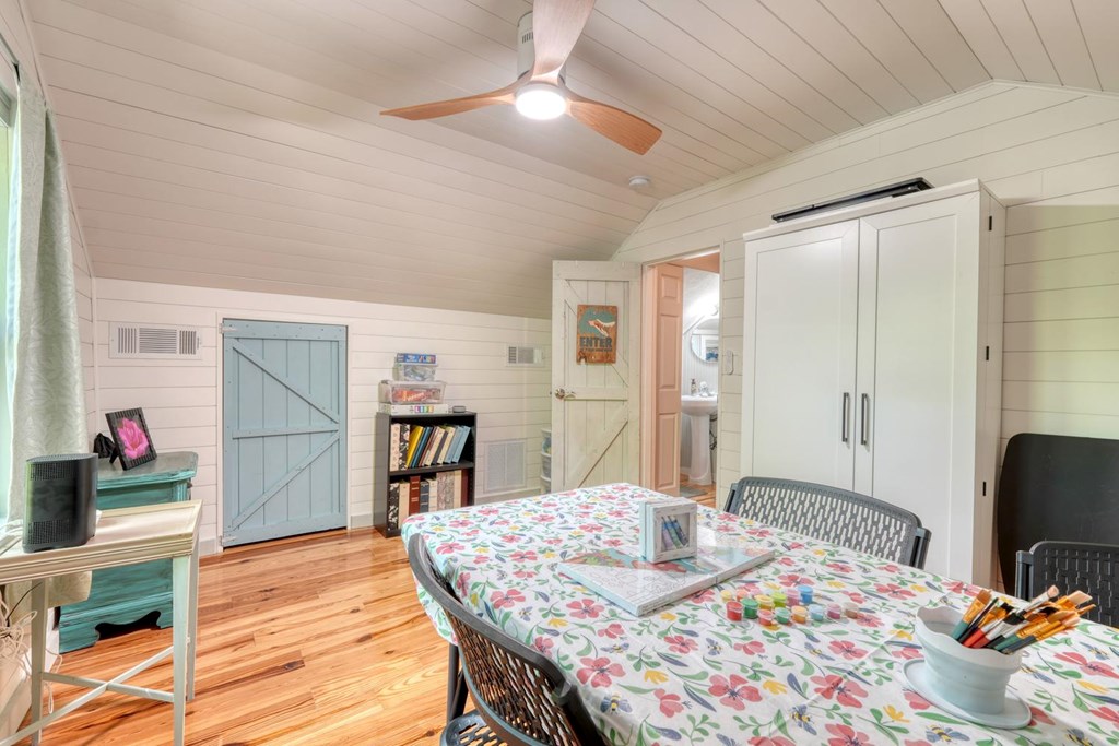 919 New Hope Road Morganton, GA 30560 - Photo 42 of 52 a bed room with a bed and a chair