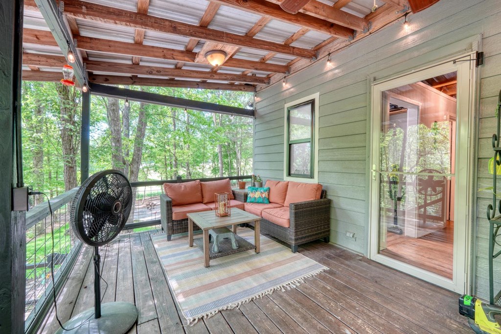 919 New Hope Road Morganton, GA 30560 - Photo 44 of 52 a balcony with furniture and a window