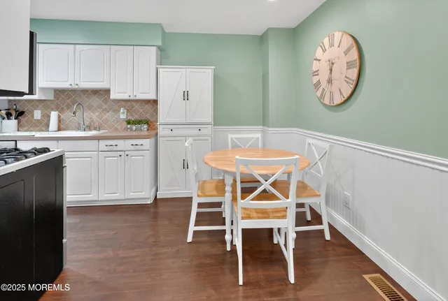 a table and chairs in a kitchen