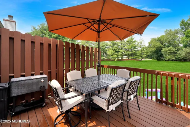 an outdoor space with furniture and umbrella