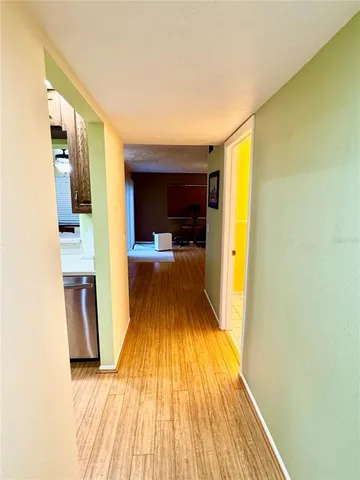 a view of a living room with a wooden floor