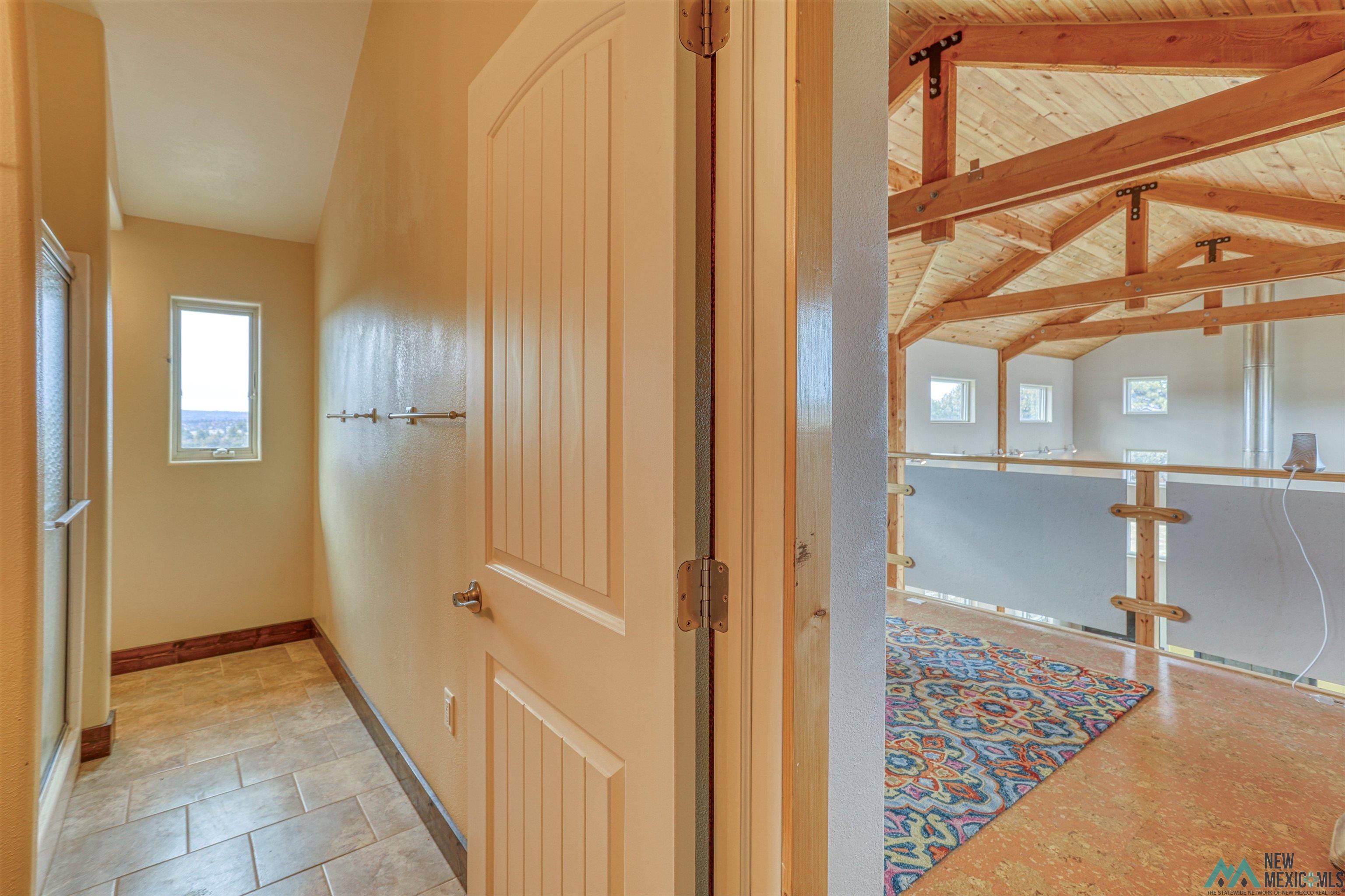 12 Horn Toad Road Chama, NM 87520 - Photo 51 of 52 Hallway with healthy amount of natural light and wooden ceiling