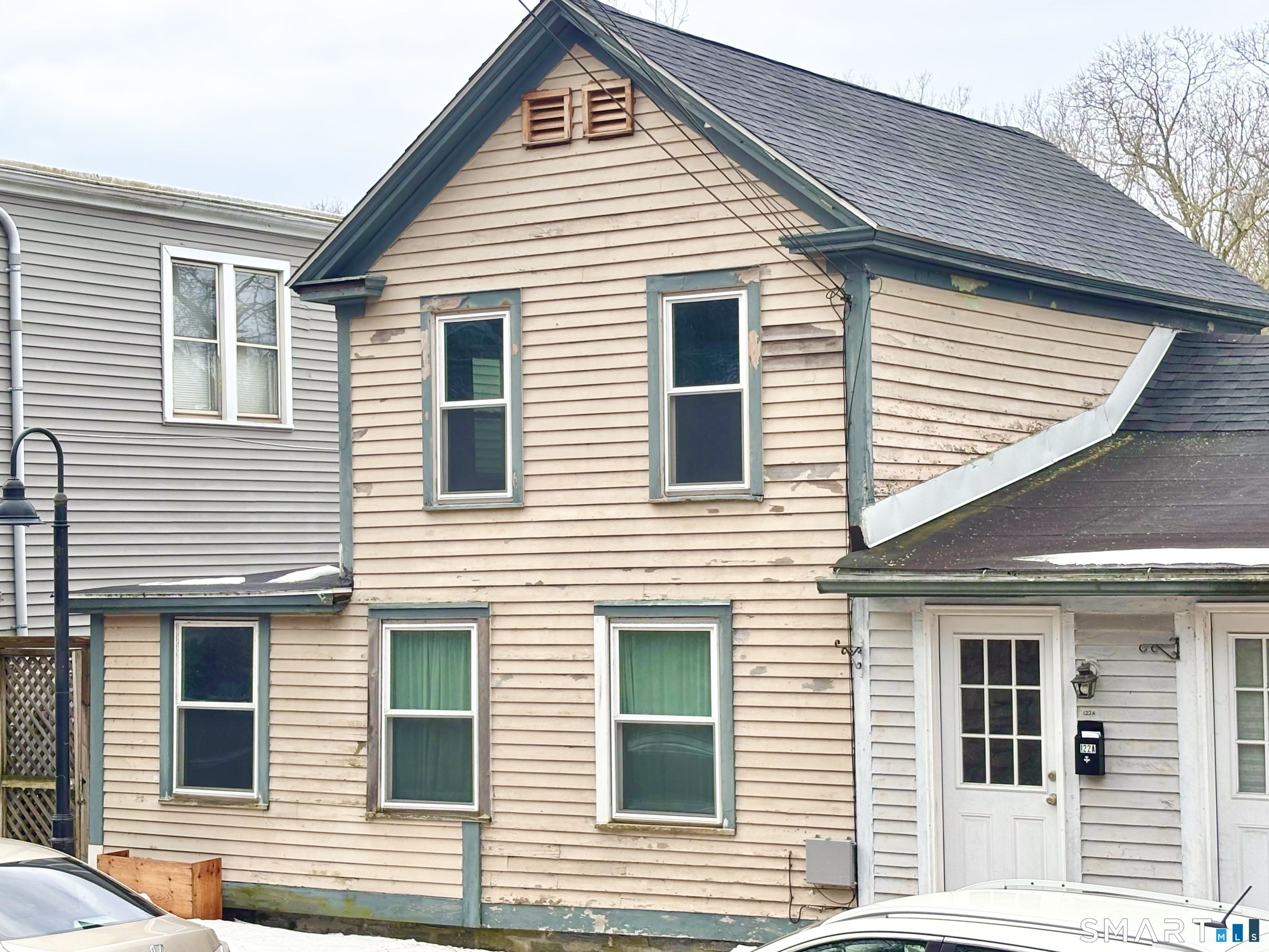 122 Main Street, Unit A Deep River, CT 06417 - Photo 1 of 1 a view of a house with a roof deck