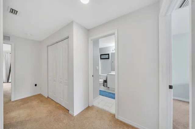 a bathroom with a sink toilet and mirror