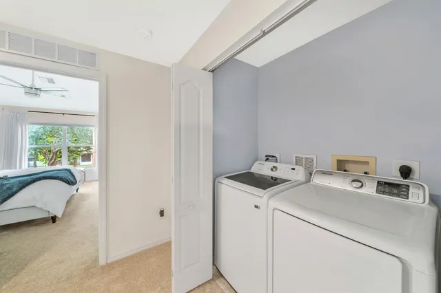 a bed room with a bed and a television