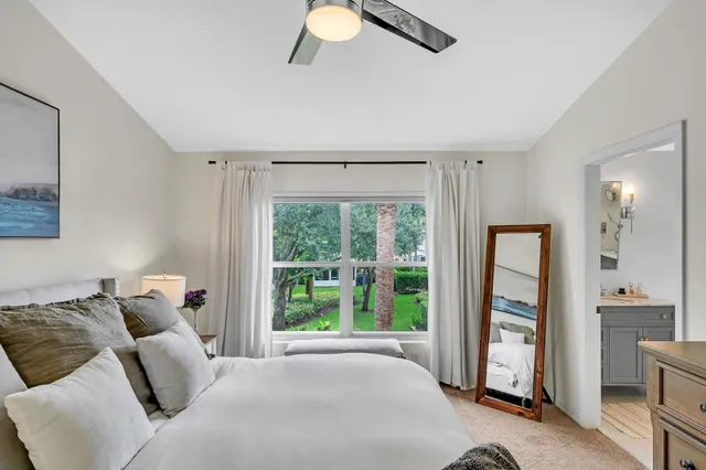 a bathroom with a granite countertop sink mirror and shower