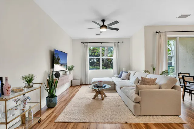 a living room with furniture and a window