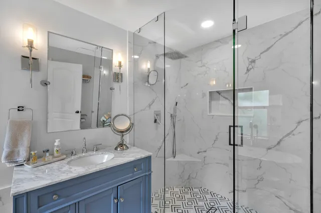 a bedroom with a bed and a flat tv screen