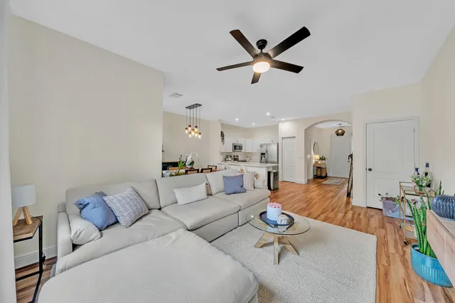a view of a dining room with furniture and chandelier