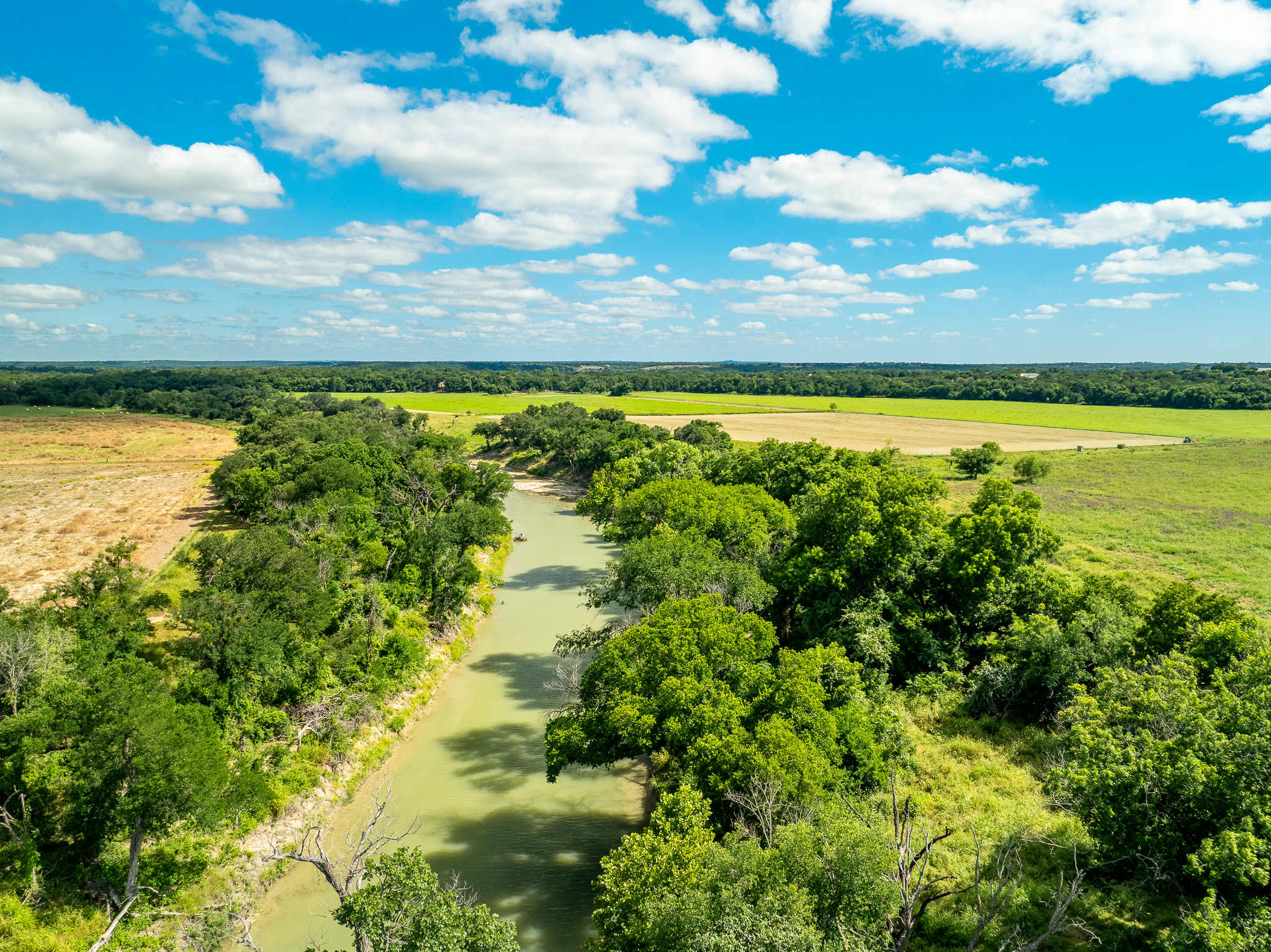 8044 580th Street East Kempner, TX 76539 - Photo 29 of 40 A tranquil river winds through verdant fields under an open sky, offering scenic natural beauty.