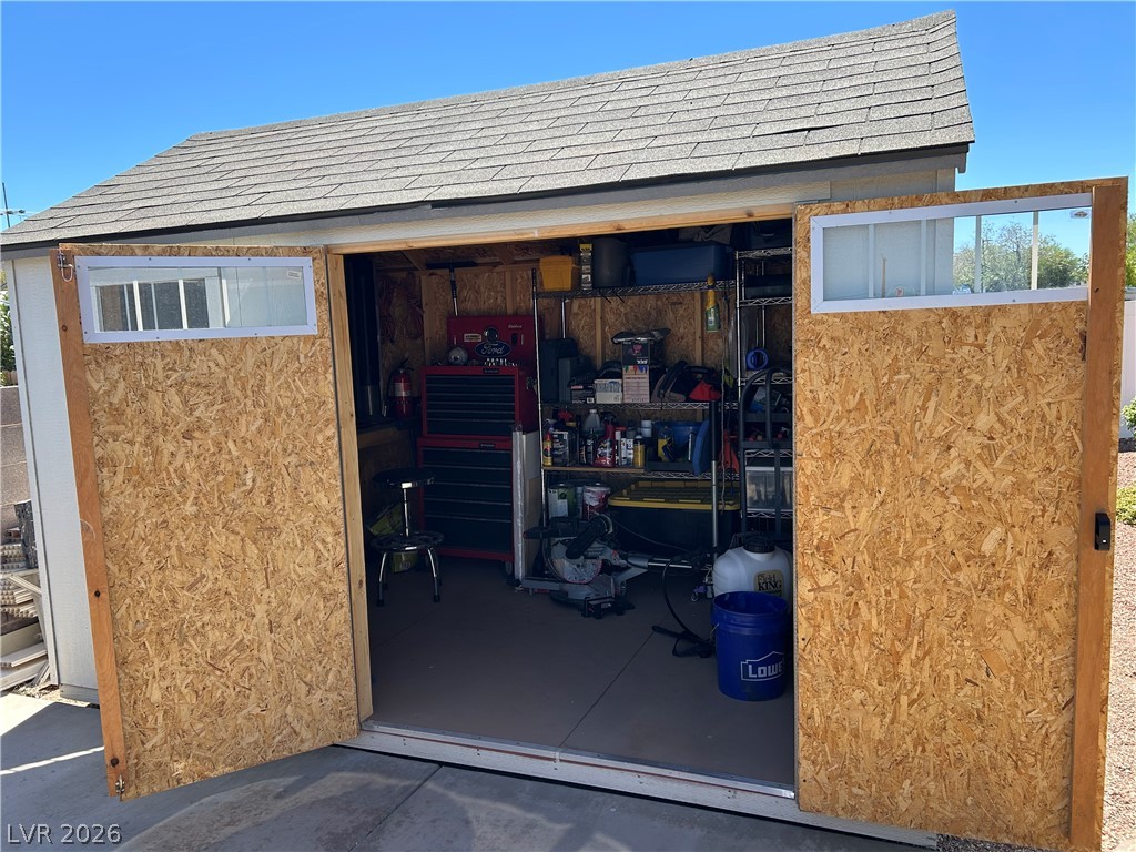 116 West Basic Road Henderson, NV 89015 - Photo 9 of 39 Secure storage shed with double-door entry and high-set window details.