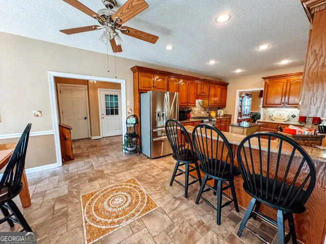 a view of a dining room with furniture window and outside view