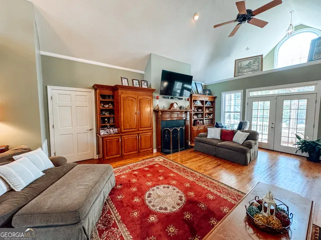 a bedroom with furniture and a wooden floor