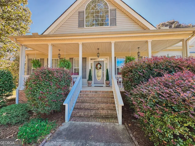 a front view of a house with garden