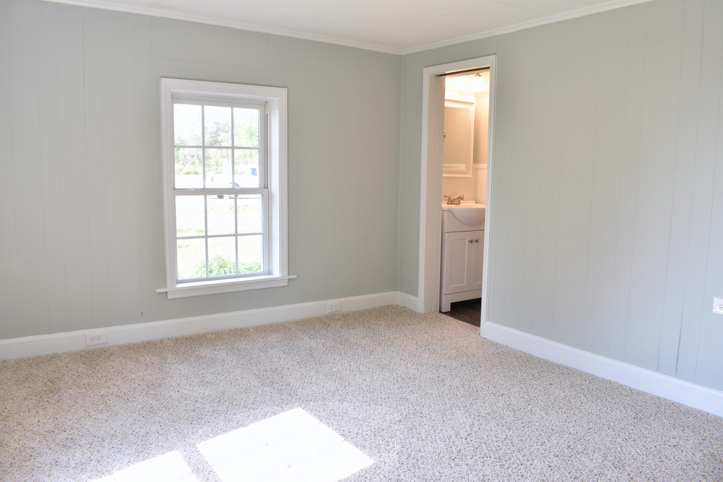 1010 Thompson Chapel Road Wilson, NC 27896 - Photo 12 of 22 Half bath off of the Master Bedroom