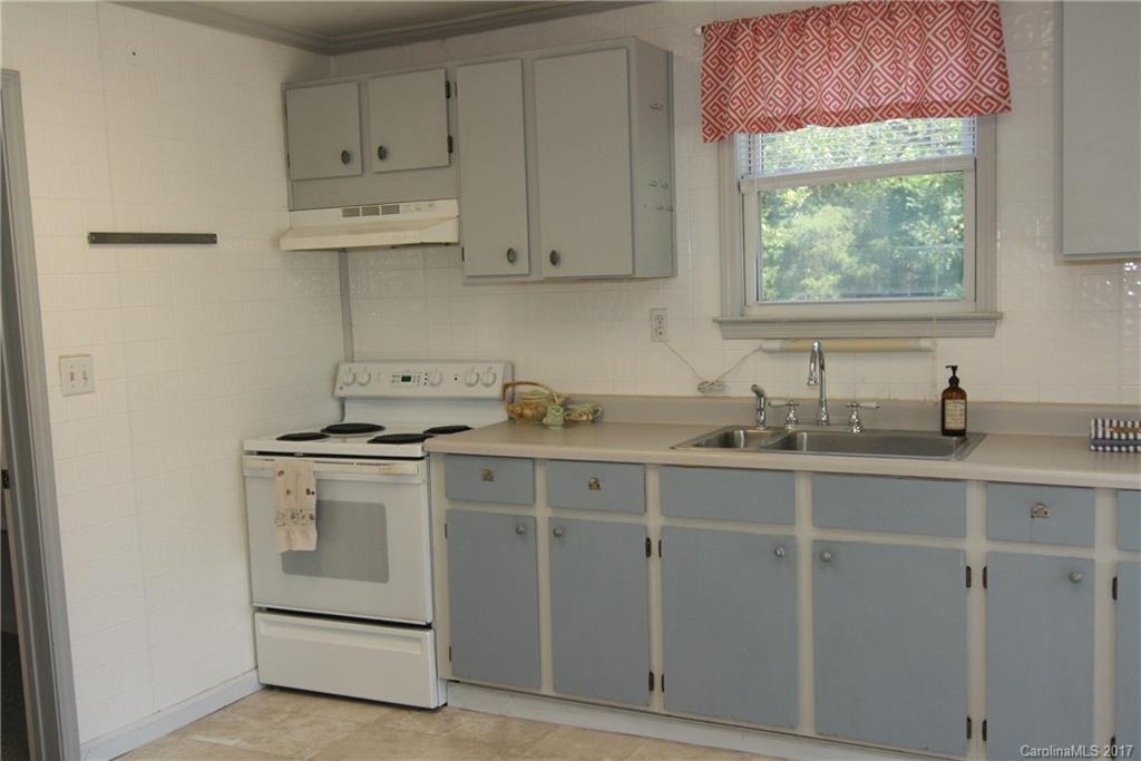 7540 Jones Road Salisbury, NC 28147 - Photo 11 of 24 a kitchen with white cabinets and white appliances