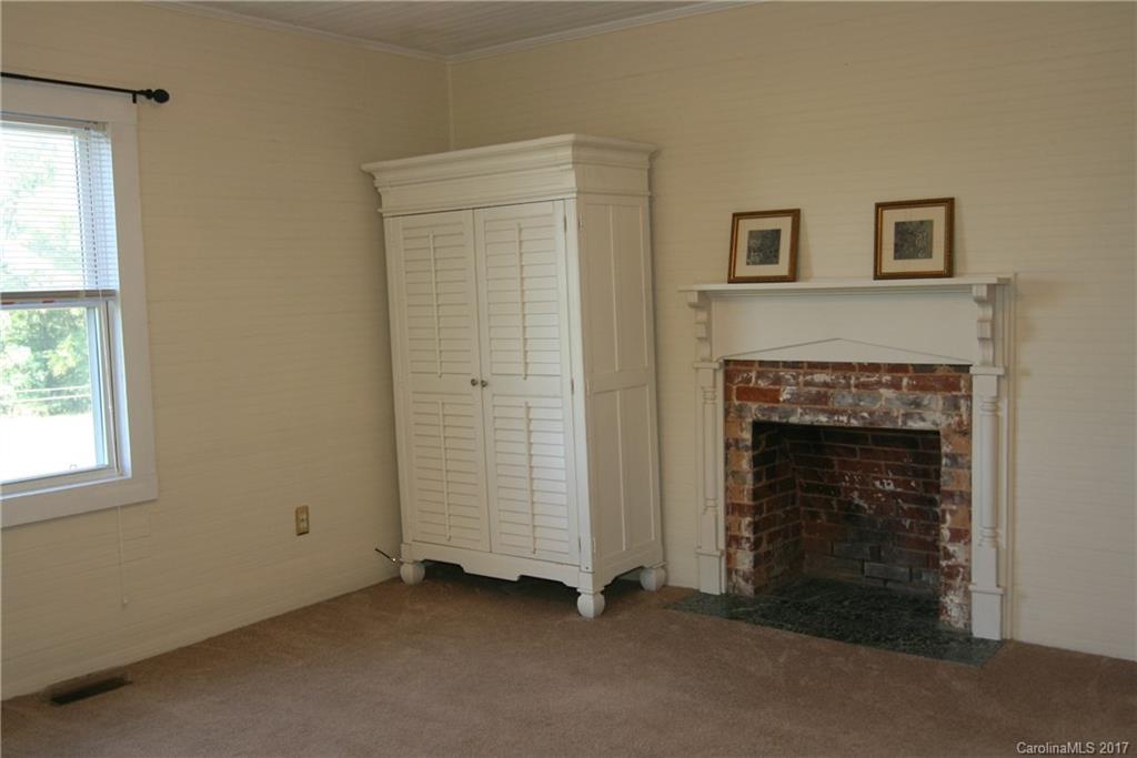 7540 Jones Road Salisbury, NC 28147 - Photo 12 of 24 a view of an empty room with a fireplace