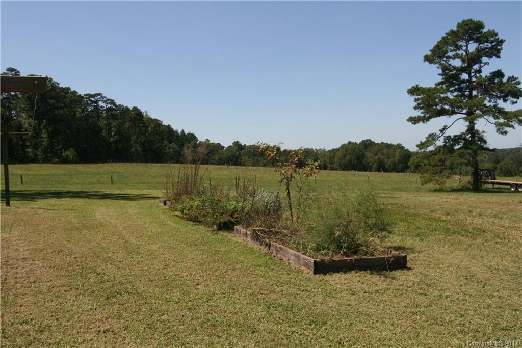 7540 Jones Road Salisbury, NC 28147 - Photo 20 of 24 a view of a lake with a yard
