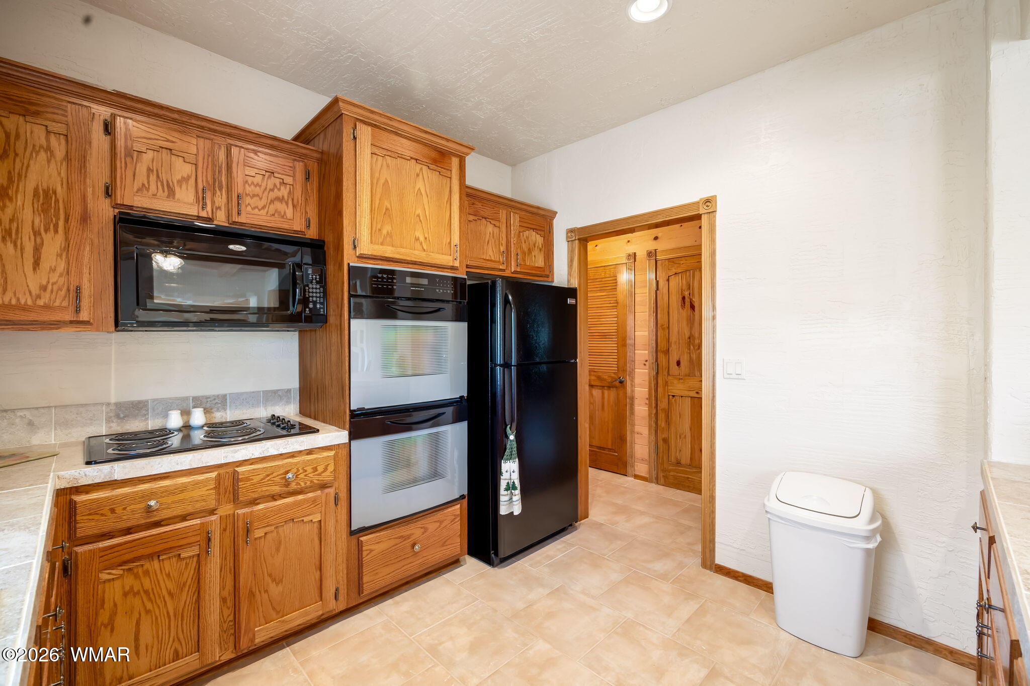 2937 Ransack Road Overgaard, AZ 85933 - Photo 15 of 34 a kitchen with stainless steel appliances a refrigerator stove and microwave