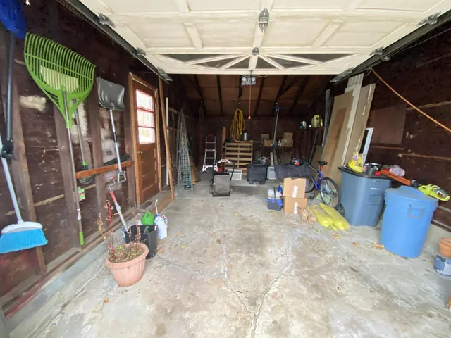 a view of a patio with table and chairs potted plants