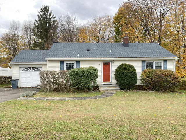 a view of a house with garden and yard
