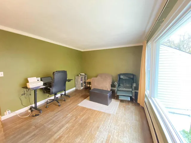 a workspace with furniture and a window