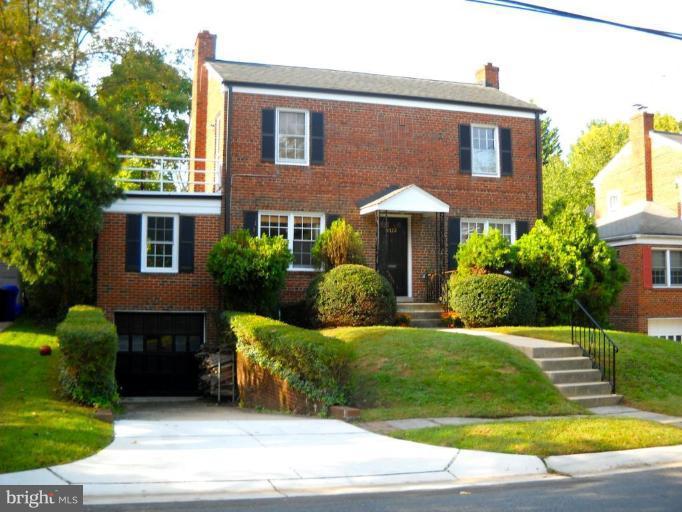 4722 Merivale Road Chevy Chase, MD 20815 - Photo 1 of 1 a front view of a house with garden