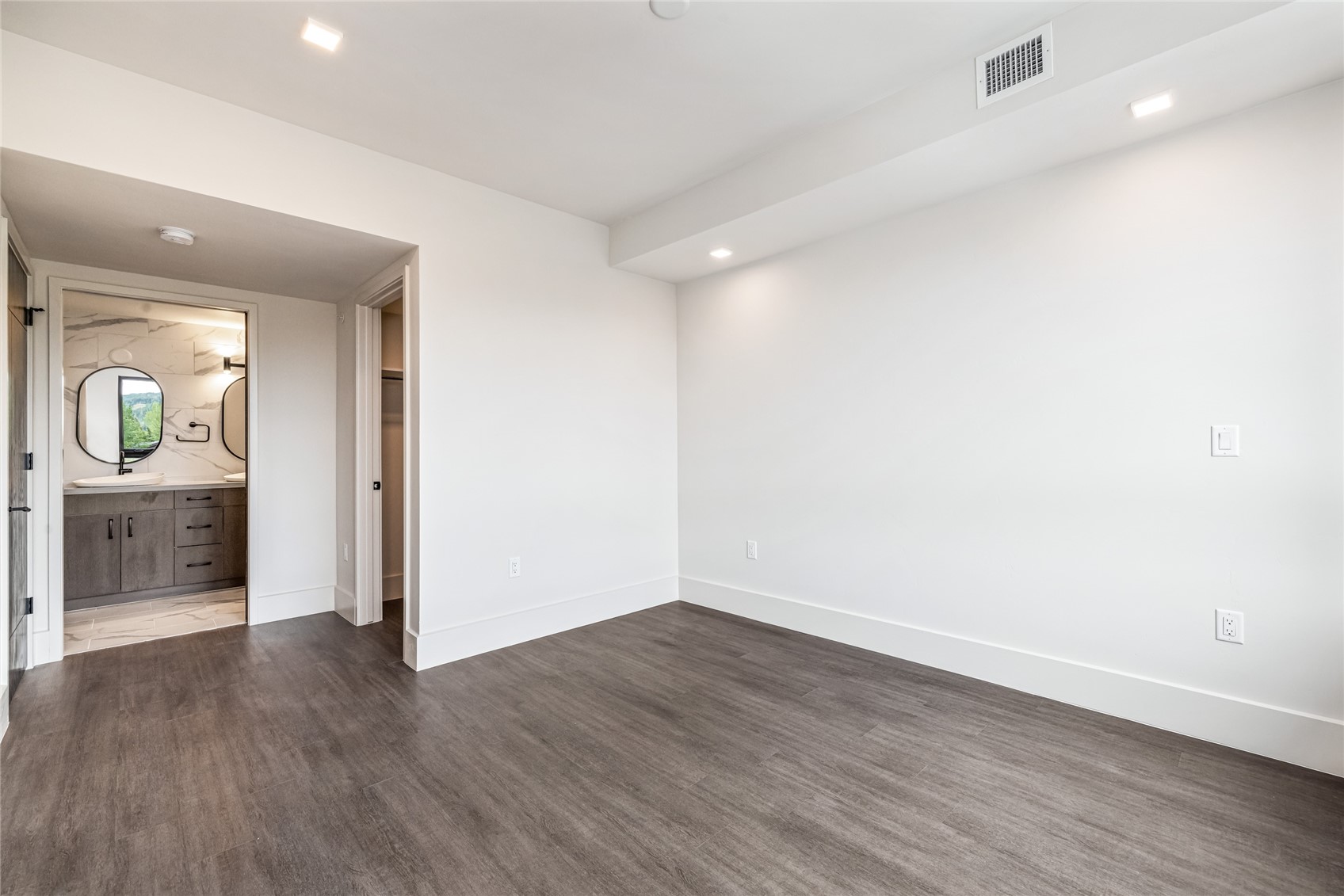 80 West Main Street, Unit 306 Frisco, CO 80443 - Photo 13 of 43 a view of a hallway with wooden floor and a living room