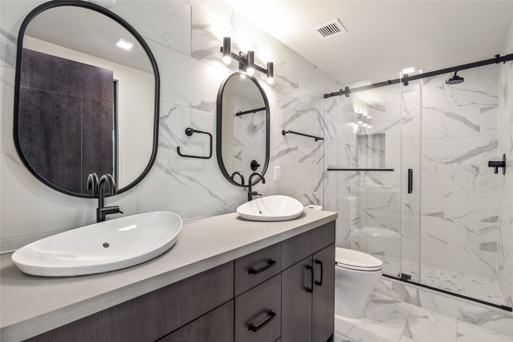 80 West Main Street, Unit 306 Frisco, CO 80443 - Photo 10 of 43 a bathroom with a double vanity sink and mirror