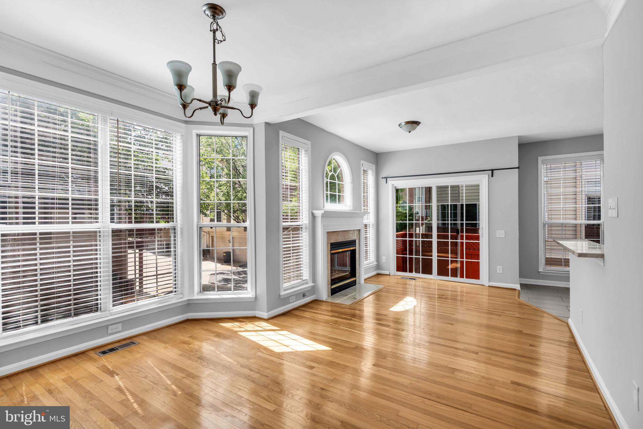 6013 Riddle Walk Alexandria, VA 22312 - Photo 8 of 31 a view of an empty room with wooden floor and a window