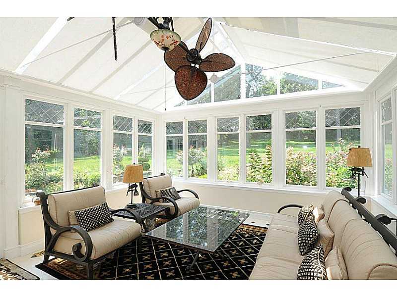 35 Hillsley Road Darien, CT 06820 - Photo 15 of 25 a living room with furniture and floor to ceiling windows
