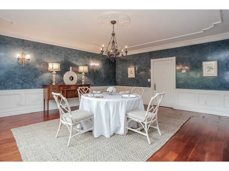 35 Hillsley Road Darien, CT 06820 - Photo 8 of 25 a dining room with a wooden table and chairs