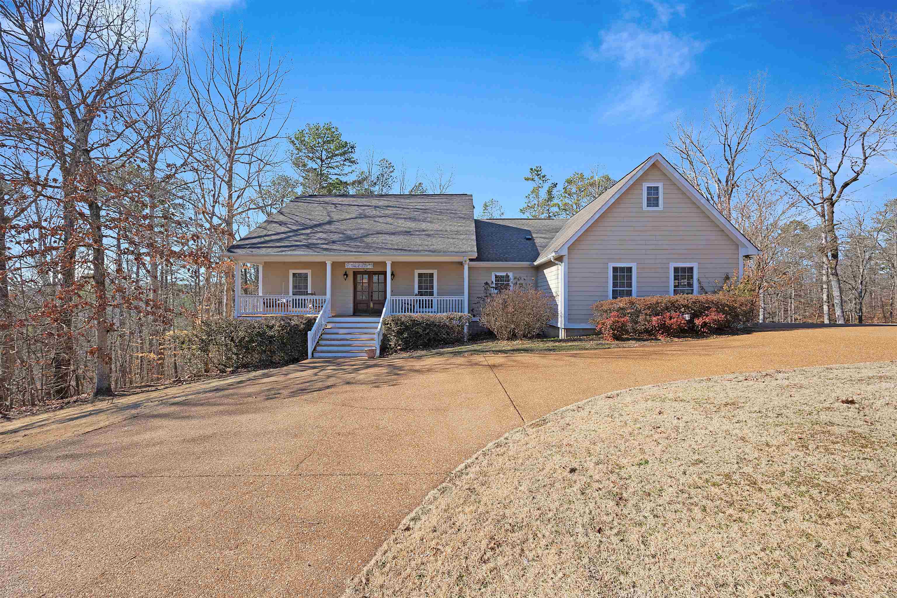 180 Strobbe Lane Counce, TN 38326 - Photo 1 of 25 a front view of a house with a yard covered in snow