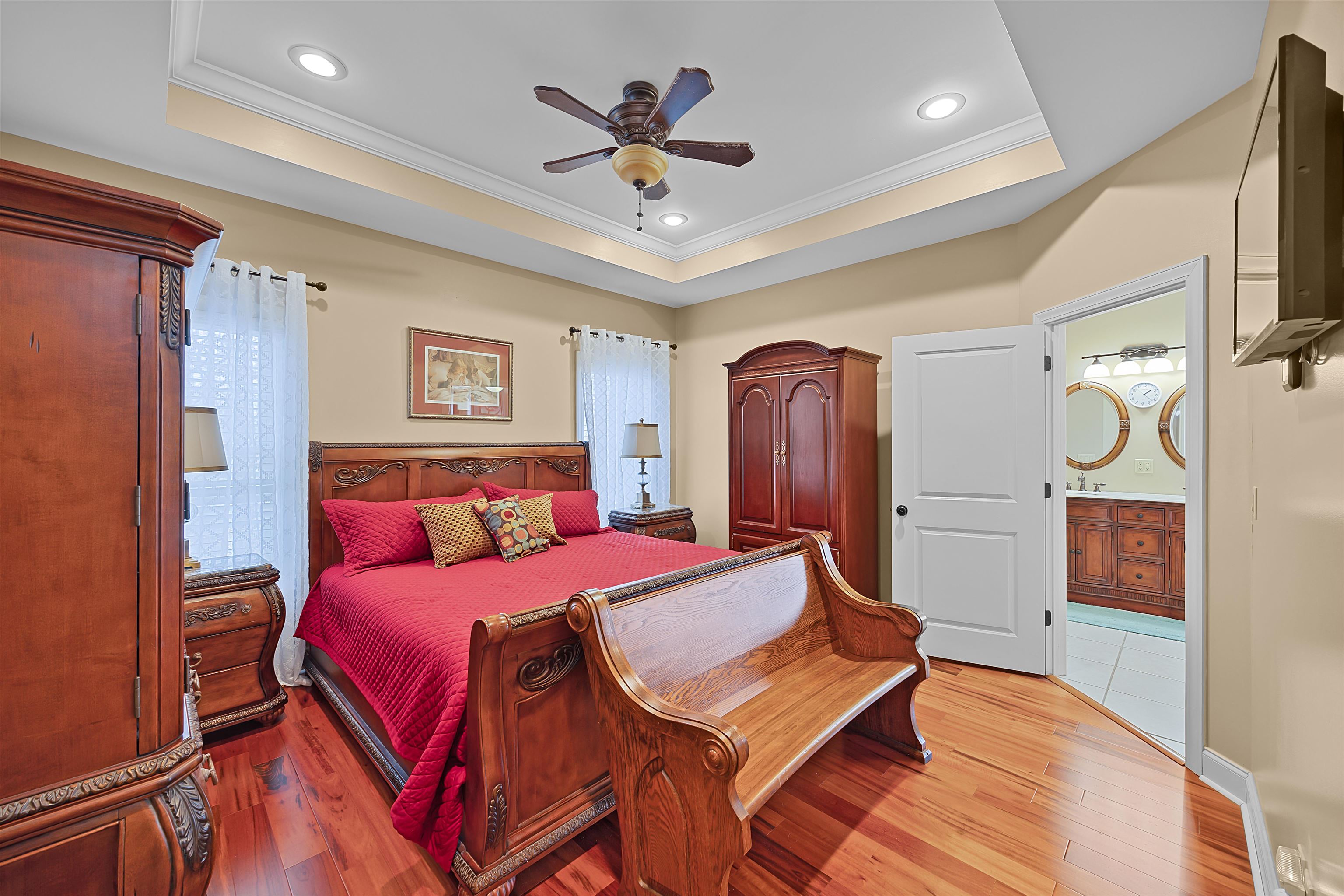180 Strobbe Lane Counce, TN 38326 - Photo 11 of 25 a bedroom with a bed and a chandelier