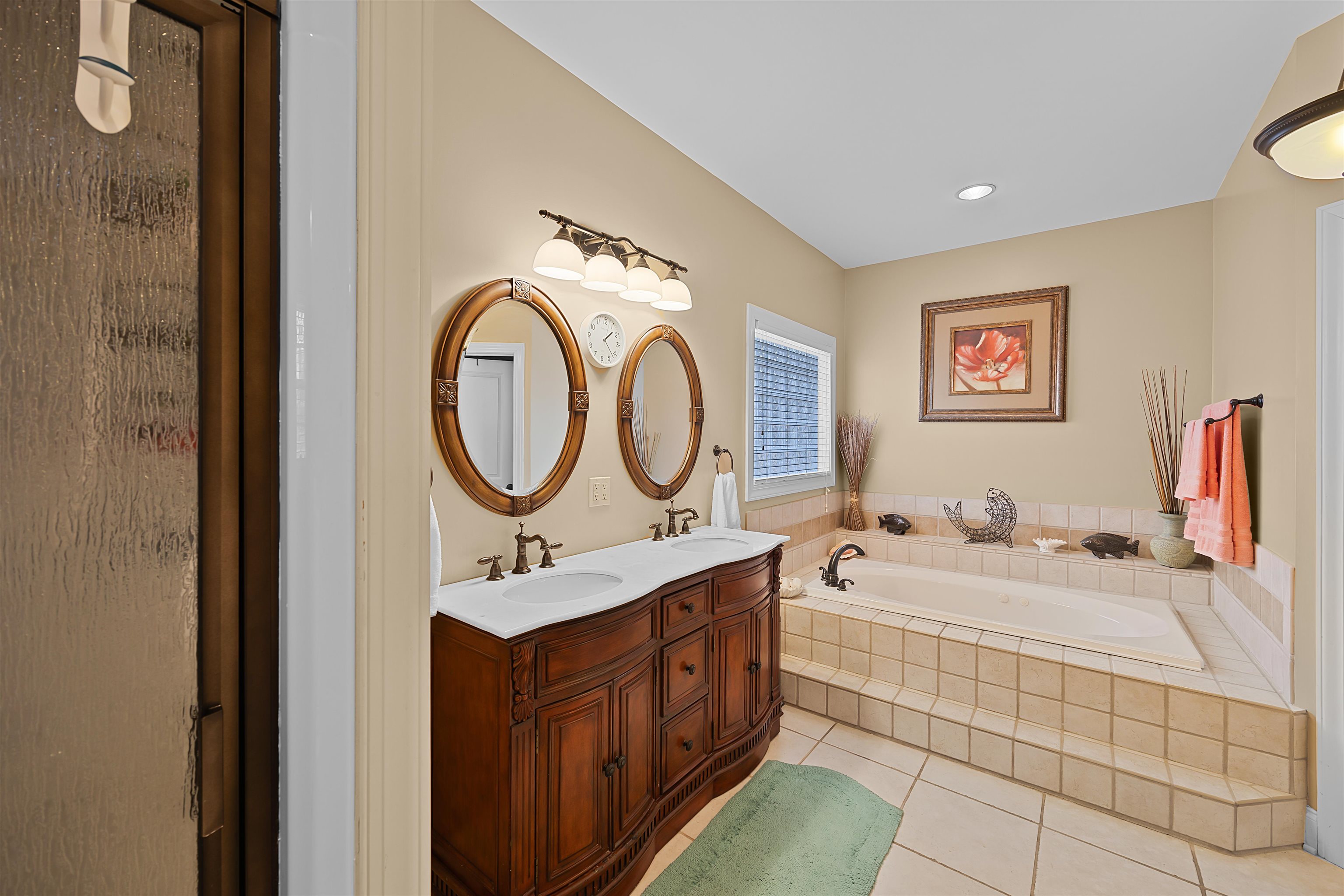 180 Strobbe Lane Counce, TN 38326 - Photo 12 of 25 a bathroom with a sink a mirror and a bathtub