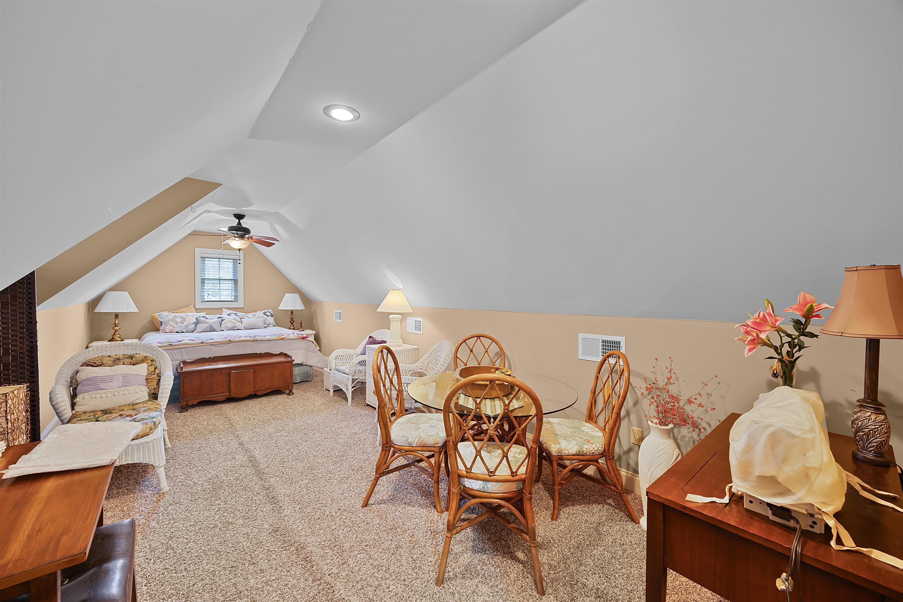 180 Strobbe Lane Counce, TN 38326 - Photo 19 of 25 a bedroom with furniture and a chandelier