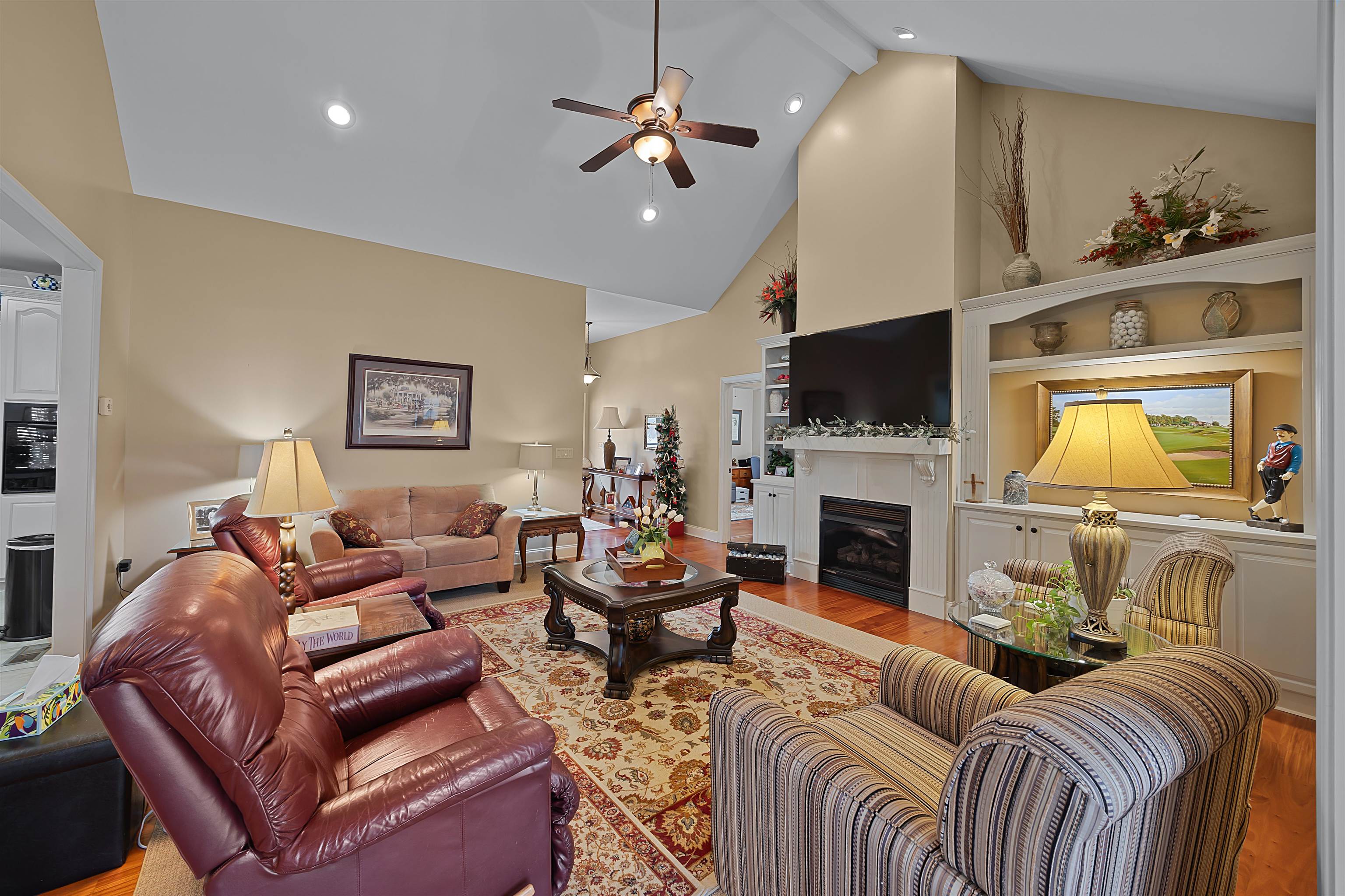 180 Strobbe Lane Counce, TN 38326 - Photo 4 of 25 a living room with furniture a fireplace and a flat screen tv
