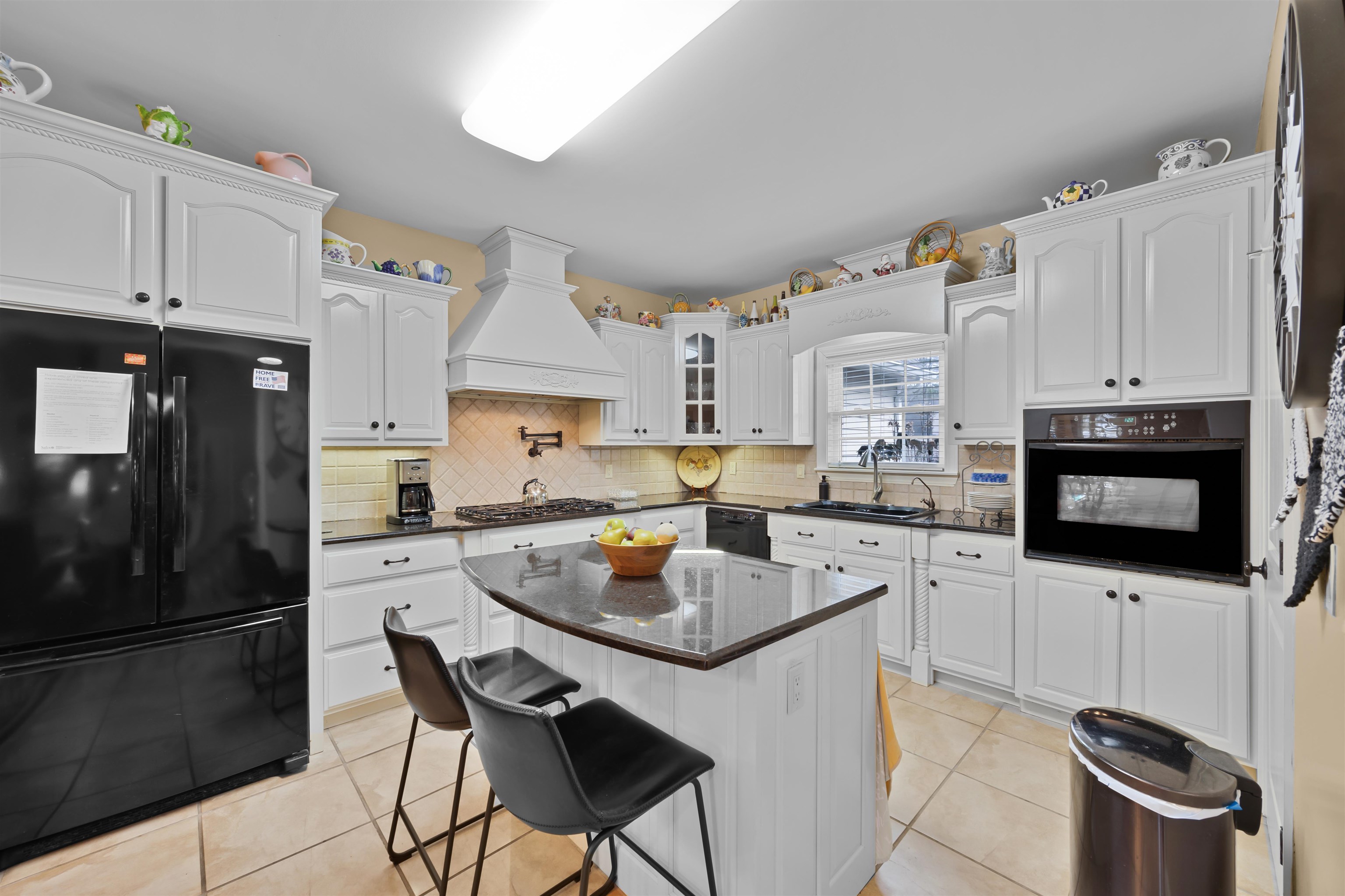 180 Strobbe Lane Counce, TN 38326 - Photo 5 of 25 a kitchen with white cabinets and stainless steel appliances
