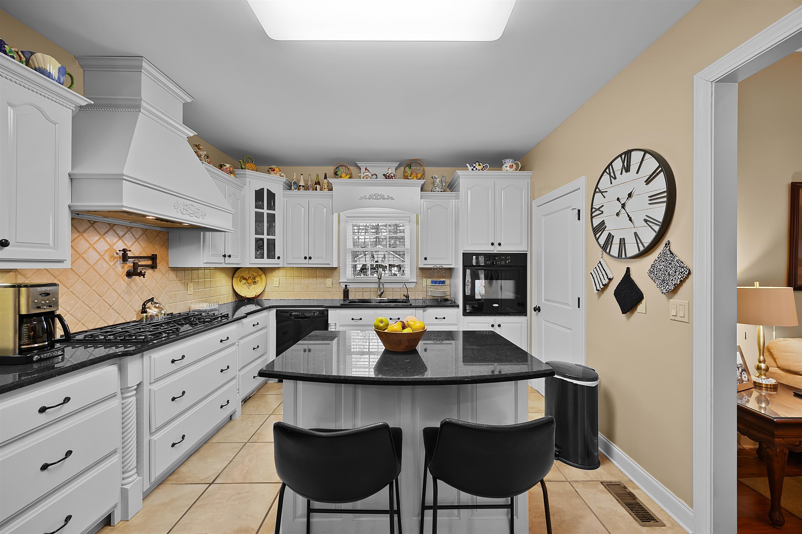 180 Strobbe Lane Counce, TN 38326 - Photo 6 of 25 a kitchen with stainless steel appliances a stove a sink cabinets and wooden floor