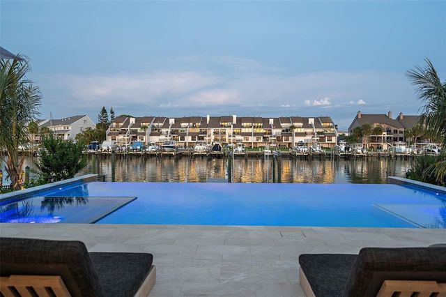 a view of swimming pool with outdoor seating
