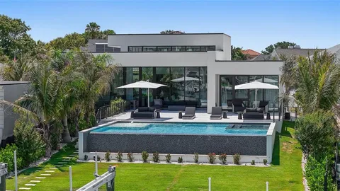 a lobby with furniture and floor to ceiling window