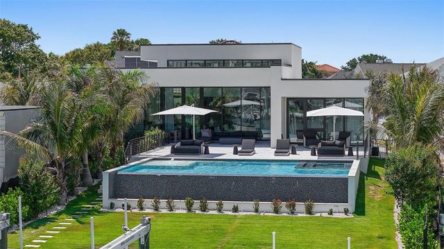 a lobby with furniture and floor to ceiling window