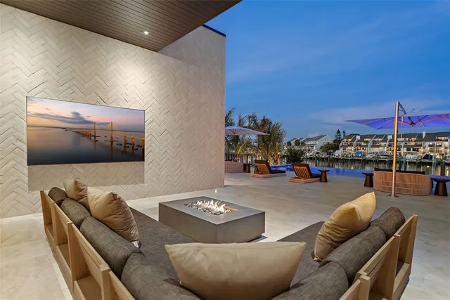 a living room with furniture and large windows